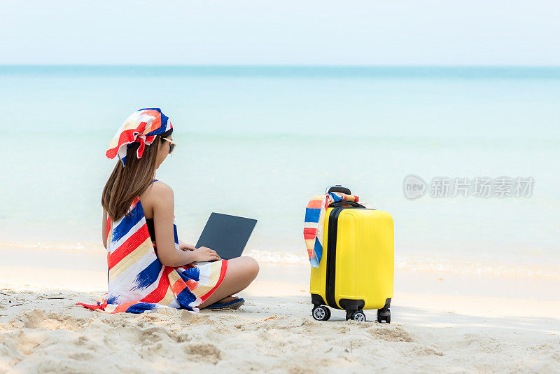 Lifestyle freelance woman using laptop working on the beach.  Asian people success and together your work pastime and meeting conference on internet in holiday.
